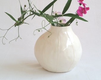 Minimalist white ceramic vase. Simple modern pottery