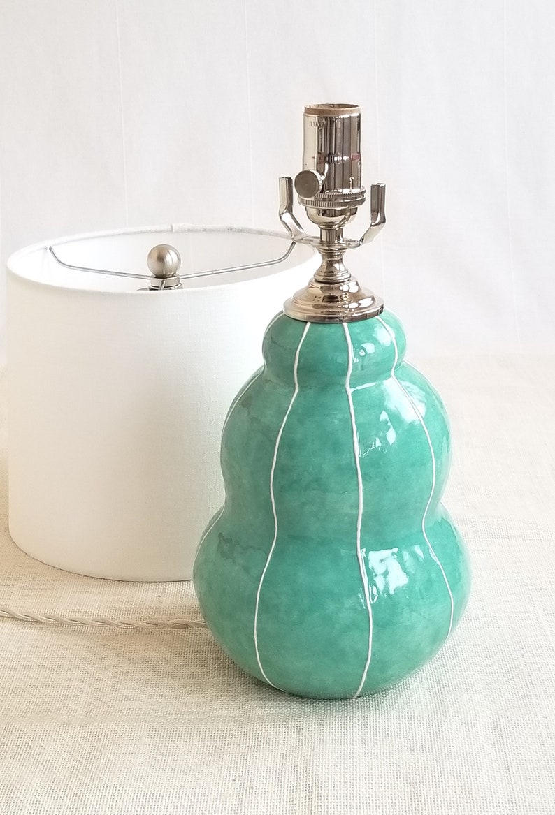 Parts included with handmade jade green ceramic lamp with white linen shade
