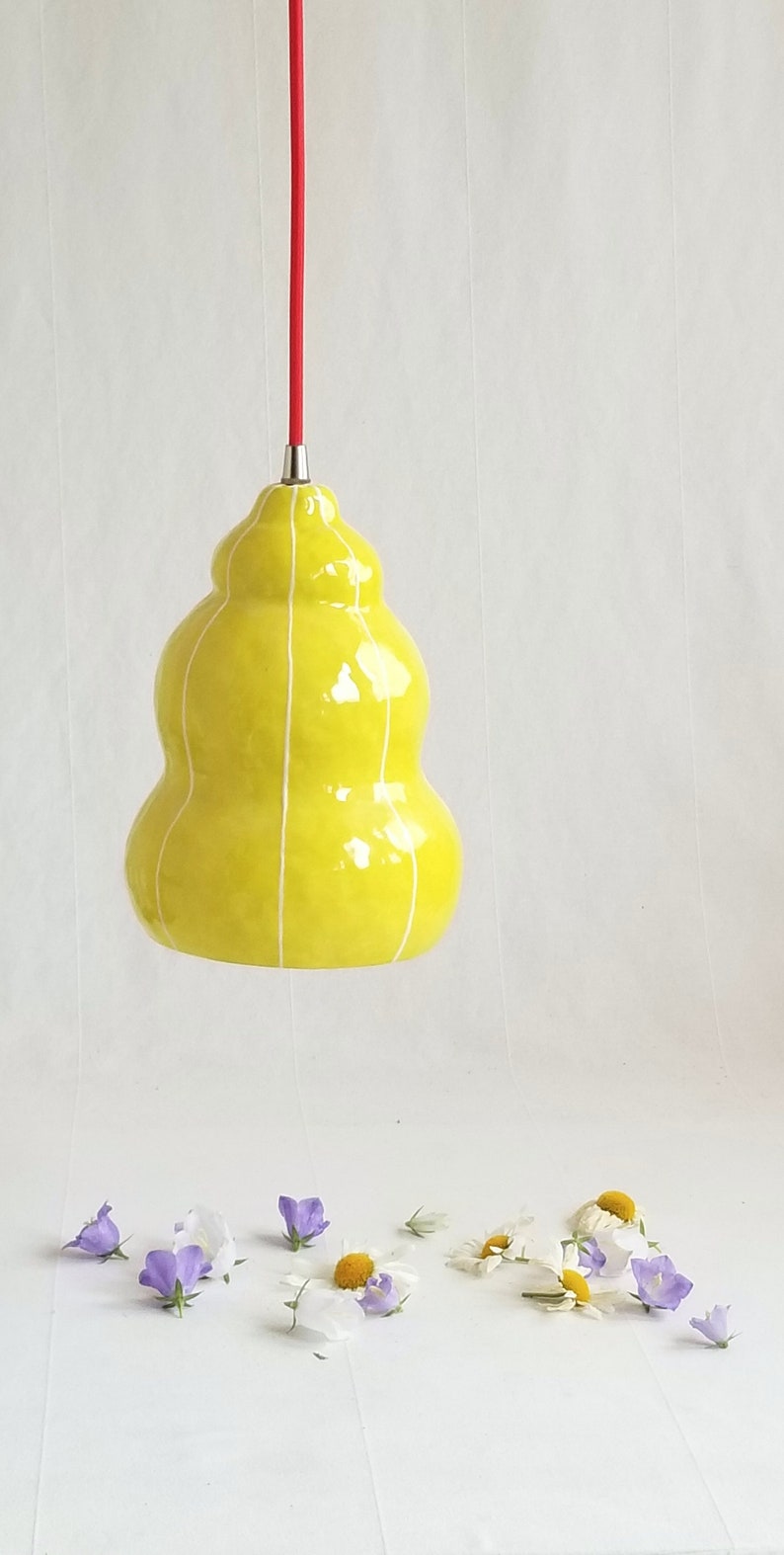 Handmade, organic form pendant light in chartreuse with thin white stripes