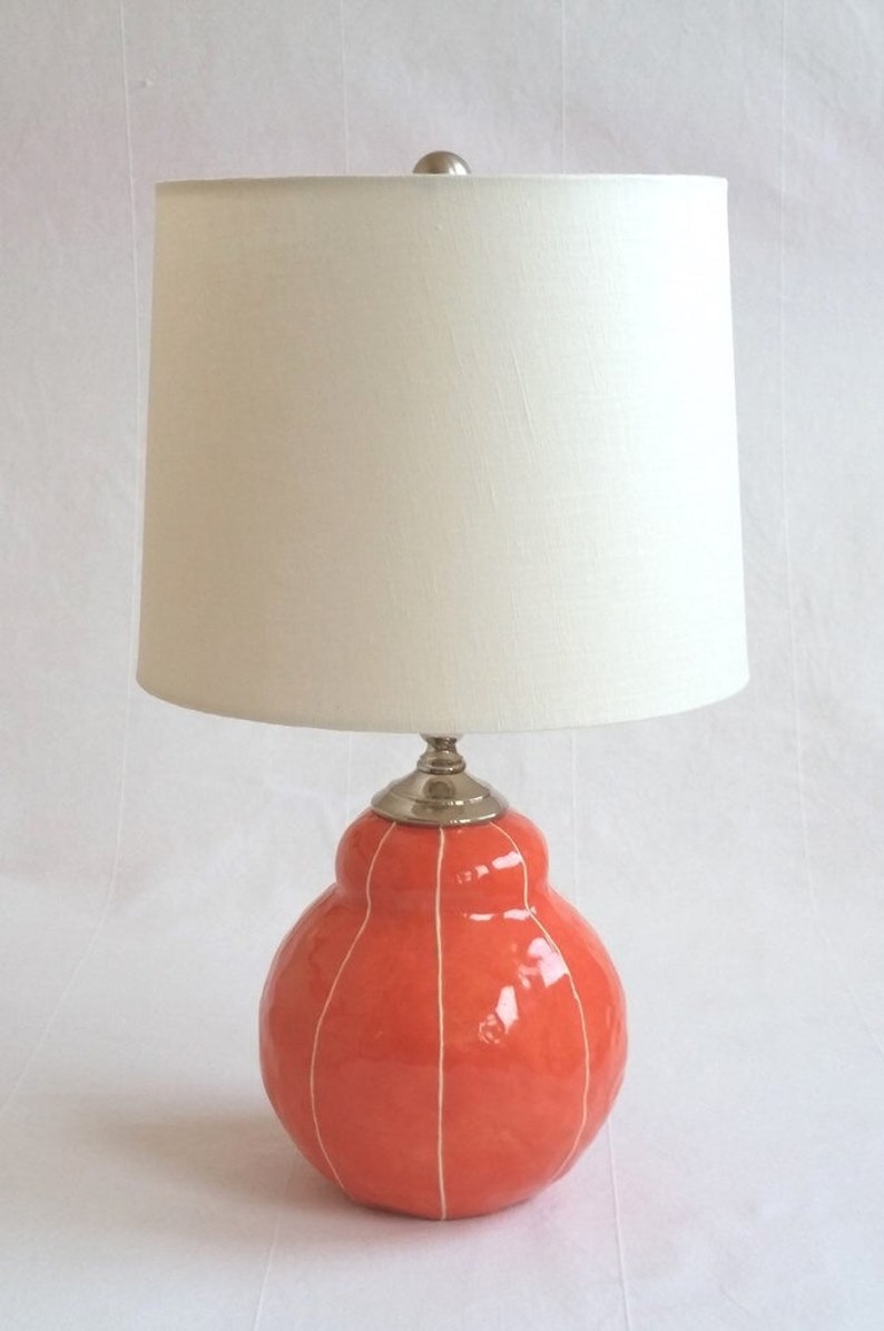 Ceramic pottery table lamp for bedside. Modern interior lighting. Custom colors coral