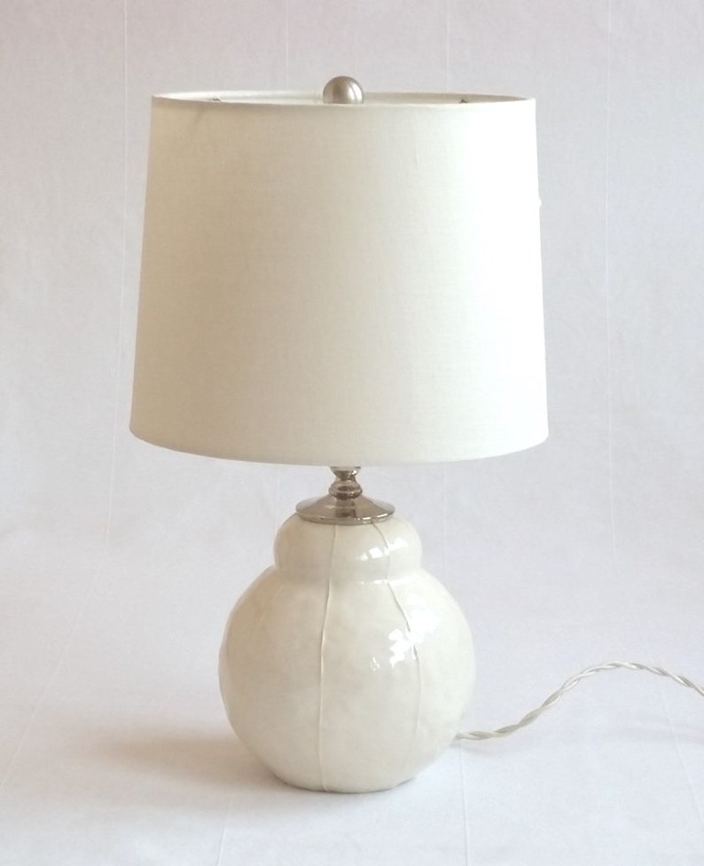 Handmade white ceramic table lamp with white stripes and white shade