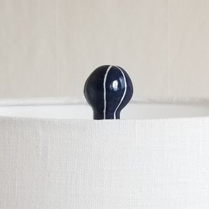 Handmade lamp finial in dark blue with carved white stripes