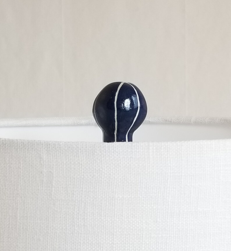 Handmade lamp finial in dark blue with carved white stripes