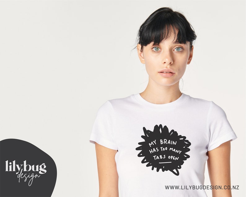 May include: White t-shirt with a black graphic that says "My brain has too many tabs open".