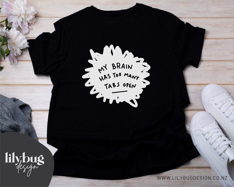 May include: Black t-shirt with white text that reads "My brain has too many tabs open".