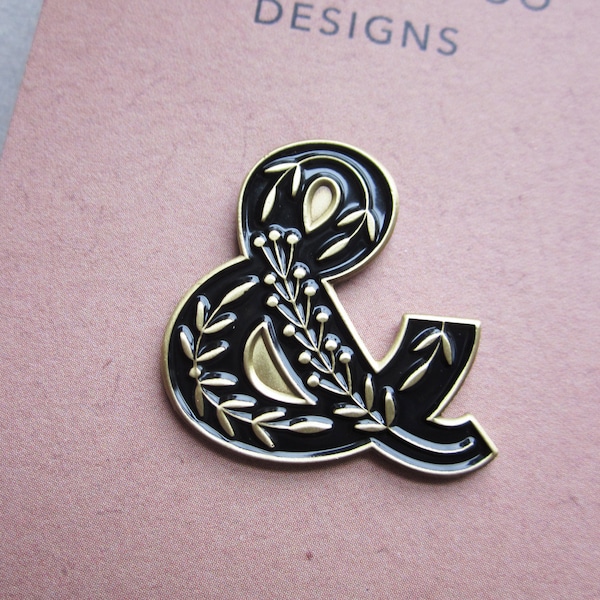 Ampersand enamel pin brooch, folk art design, black and gold metal, typography design
