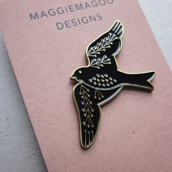 Bird enamel pin brooch, black and gold metal, swallow folk design