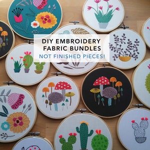 May include: A collection of circular wooden embroidery hoops containing fabric with various stitched designs of flowers, cacti, and mushrooms. The text DIY EMBROIDERY FABRIC BUNDLES NOT FINISHED PIECES! is overlaid in the centre of the image.