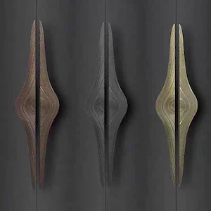May include: Three decorative door handles in different finishes: gold, black, and brown. Each handle has a unique, organic, and abstract design.