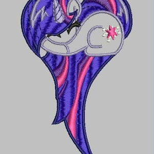 May include: Purple and pink heart-shaped design featuring a cartoon unicorn with a purple horn and a pink star on its flank.