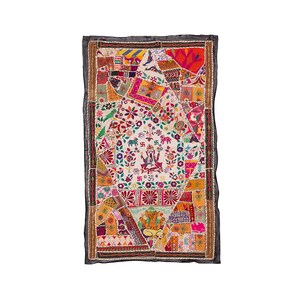 May include: A colorful patchwork wall hanging with a white background. The hanging features intricate embroidery of Hindu deities, elephants, and floral patterns. The border is black with a decorative trim.