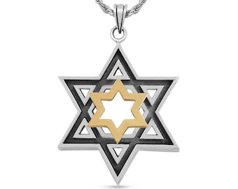 May include: A silver chain necklace with a silver and gold Star of David pendant. The pendant is a double layered star with a gold center.