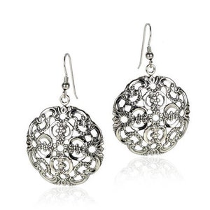 May include: Silver filigree earrings with a circular design. The earrings have a delicate, intricate pattern and a drop style.