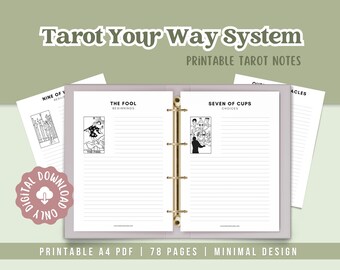 May include: A digital download of a Tarot Your Way System printable tarot notes. The image shows a binder with lined pages and tarot card illustrations. The text includes "The Fool" and "Seven of Cups". The design is minimal.