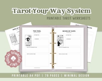 May include: A digital download of printable tarot worksheets. The open binder displays pages with tarot card illustrations and prompts for affirmations, keywords, and reflections. The text reads "Tarot Your Way System" and "Printable Tarot Worksheets."