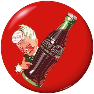 May include: A vintage Coca-Cola advertisement featuring a smiling cartoon character with a bottle cap on their head, pointing at a Coca-Cola bottle. The bottle is dark brown with the Coca-Cola logo and trademark information. The background is a solid red circle.