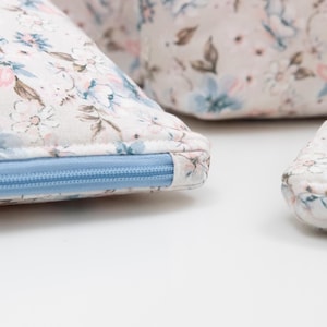 Close-up of a zip pouch showing the neatly covered zip end, a beginner-friendly finishing detail.