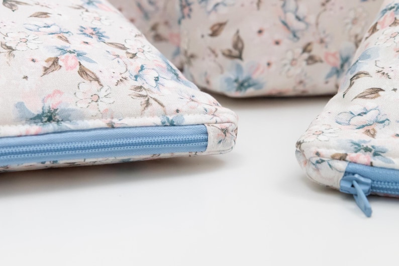 Close-up of a zip pouch showing the neatly covered zip end, a beginner-friendly finishing detail.