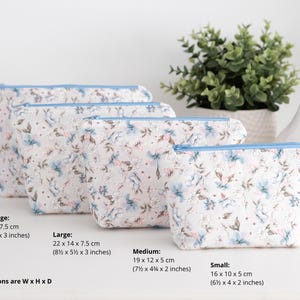 Size guide for the zip pouch sewing pattern showing all four dimensions in centimetres and inches, width by height by depth.