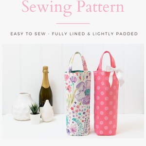 May include: Two wine tote bags. One is pink with white polka dots and a white bow. The other is floral with purple, pink, and green flowers. The text reads "Wine Tote Bag Sewing Pattern".