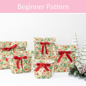 May include: A set of four fabric bags in varying sizes featuring a light green background with a festive pattern of red berries, green leaves, and candy canes. Each bag has a folded top edge and is tied with a bright red satin ribbon bow.