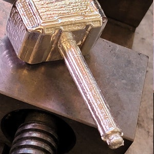 Thor Hammer 2 sided pour Mold in a 3 or 6 oz size. Let us know what size you prefer after purchase;)