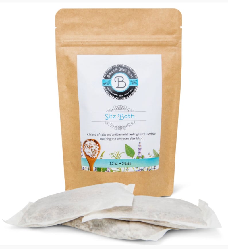 May include: A brown paper bag with a white label that says "Birds & Bees Teas" and "Sitz Bath". The label also says "A blend of salts and antibacterial healing herbs used for soothing the perineum after labor." and "3.2 oz - 3 Uses". There are three white tea bags in front of the bag.