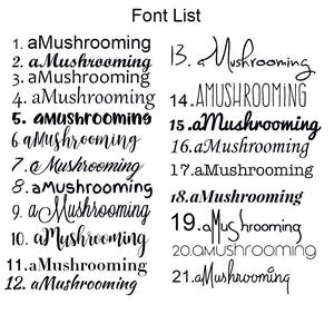 May include: A black and white font list displaying the word aMushrooming in twenty-one distinct typographic styles, numbered one through twenty-one, arranged in two columns on a plain white background for comparison of various lettering designs.