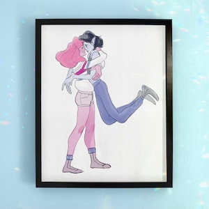 May include: A framed art print depicting two figures in an embrace. One figure has pink hair, wearing a white top and pink shorts. The other has dark hair, wearing a white top and blue trousers. The artwork is set against a white background, with a black frame.