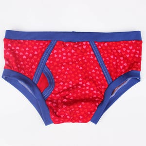Bright men&#39;s underwear. Briefs red with little hearts