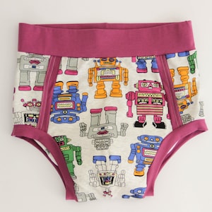 May include: White underwear with a pink waistband and a repeating pattern of colourful robots.