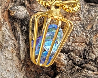 Vintage golden bird cage pendant with iridescent glass rhinestones