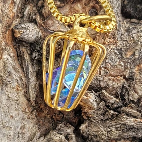 Vintage golden bird cage pendant with iridescent g