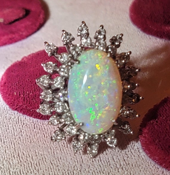 Giant spectacular opal and 4 tiered diamond cluste