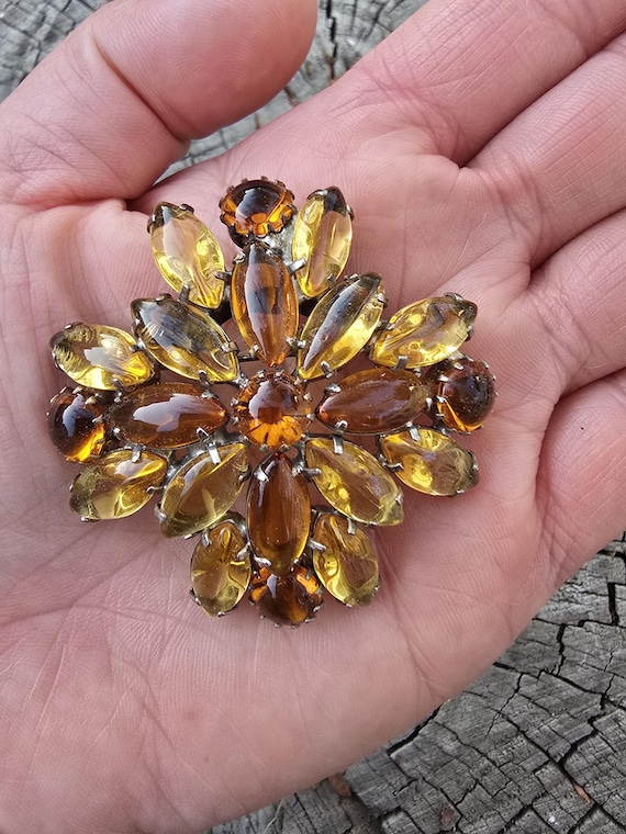 Amber colored glass brooch