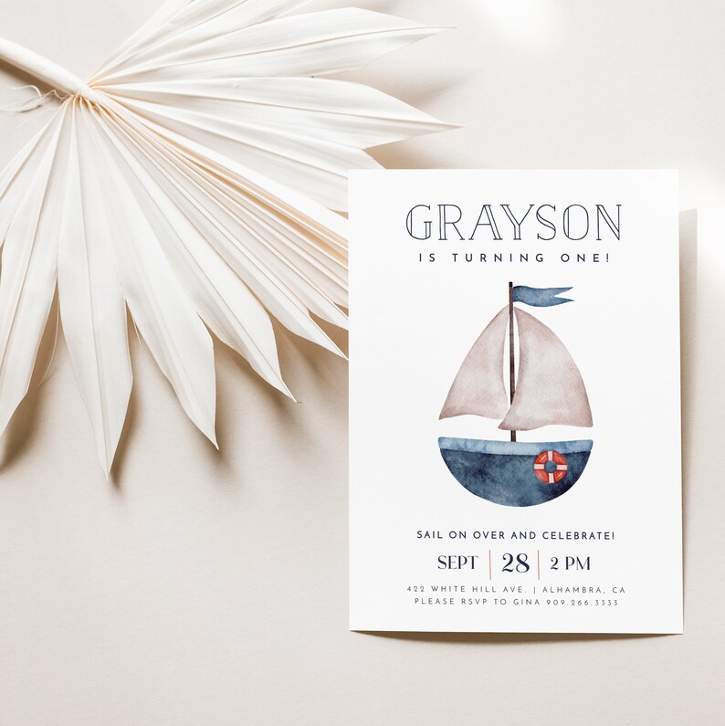 May include: A blue and white sailboat with a red life preserver on a white card with the text "GRAYSON IS TURNING ONE!" and "SAIL ON OVER AND CELEBRATE! SEPT 28 2 PM 422 WHITE HILL AVE. ALHAMBRA, CA PLEASE RSVP TO GINA 909.266.3333"