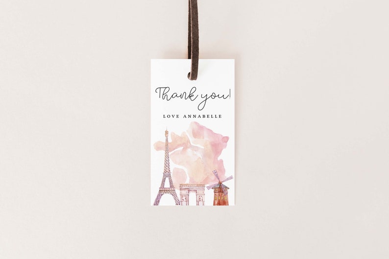 May include: A white thank you tag with a watercolor illustration of the Eiffel Tower, Arc de Triomphe, and a windmill. The text "Thank you! Love Annabelle" is printed on the tag.