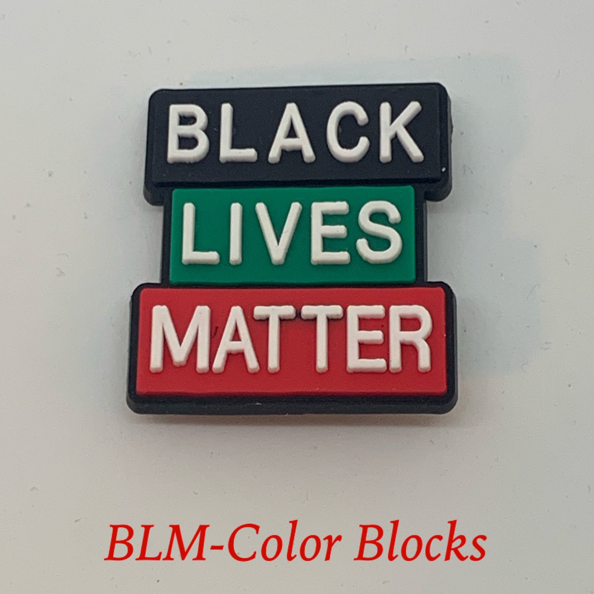 black power croc charms
