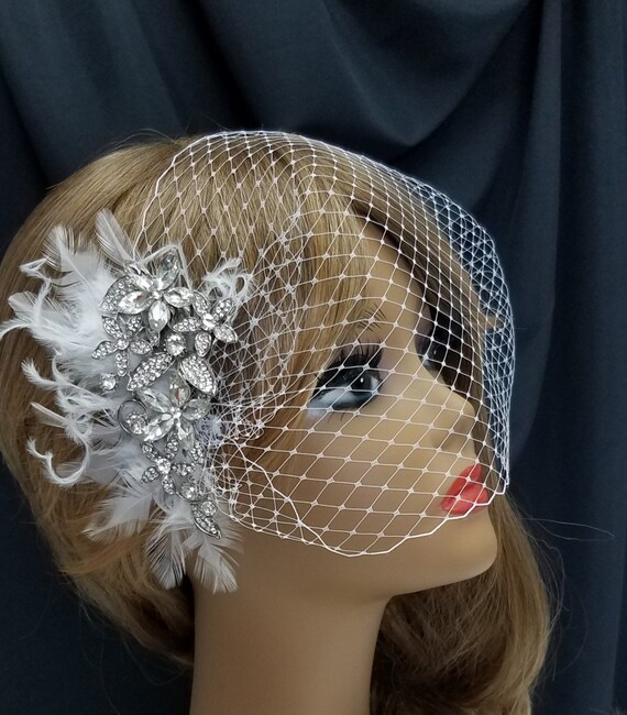 Feather and Rhinestone Headpiece Amazon.com: BABEYOND 1920s Flapper Peacock Feather Headband  main image 2