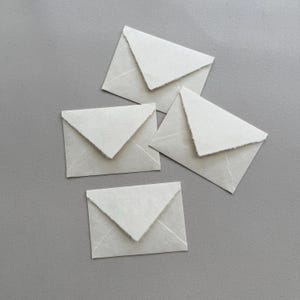 140 buste A7 color avorio con bordo frastagliato fatte a mano