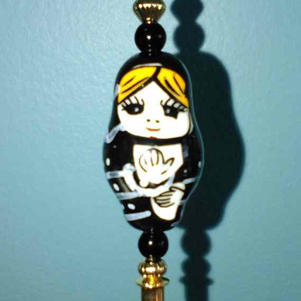 Hat Pin 5 inch gold like with a Russian Nesting Doll ceramic bead