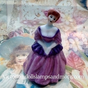 Miniature Victorian Lady Porcelain in pink with purple accents and ruffle around waist(NEW PRICE)