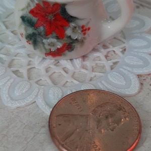 Miniature White Porcelain Pitcher with Poinsettia decal on both sides with vinyl doily