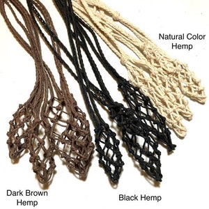 May include: Close-up of several hemp plant holders in various colors. The colors include dark brown, black, and natural. The holders are made of woven hemp and are designed to hold small items. Text on the image reads "Dark Brown Hemp", "Black Hemp", and "Natural Color Hemp."