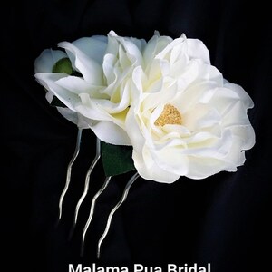 Custom silk Gardenia Wedding headpiece by Malama Pua Bridal.  This hair accessory is a traditional classic Bridal Gardenia hair clip and is created with hand wired crystal center and completed with tropical green leaves.