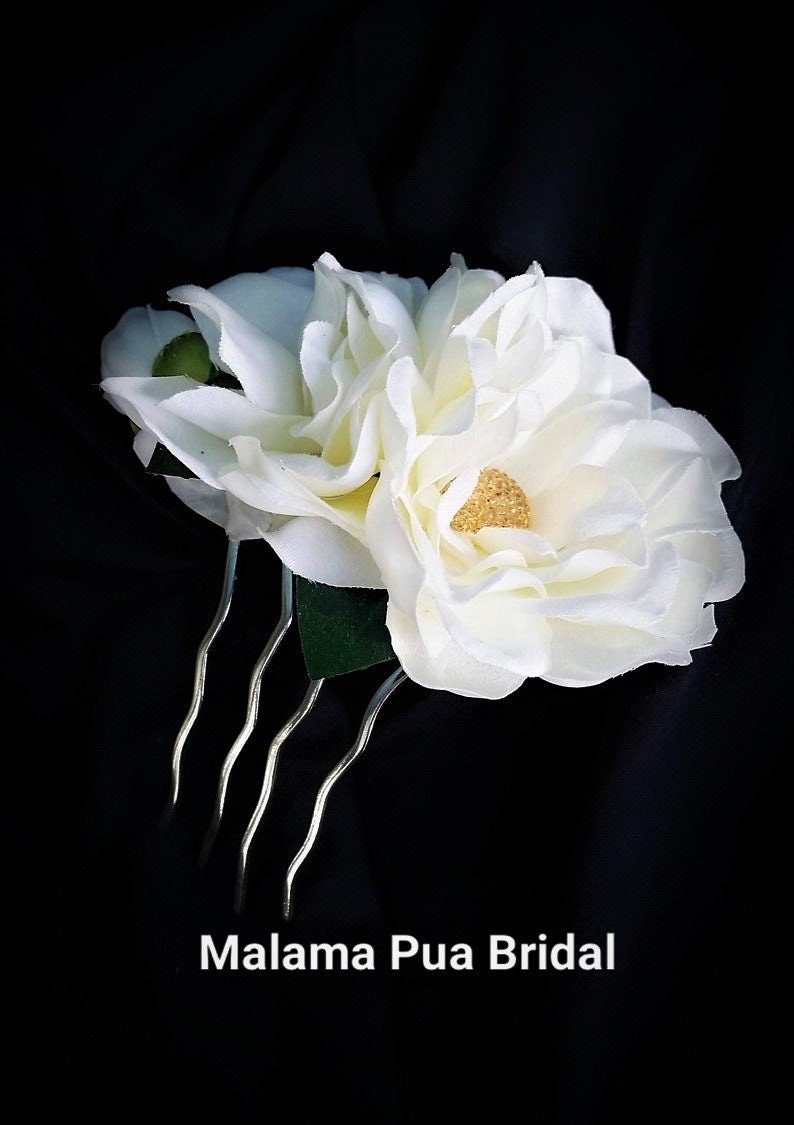 Custom silk Gardenia Wedding headpiece by Malama Pua Bridal.  This hair accessory is a traditional classic Bridal Gardenia hair clip and is created with hand wired crystal center and completed with tropical green leaves.