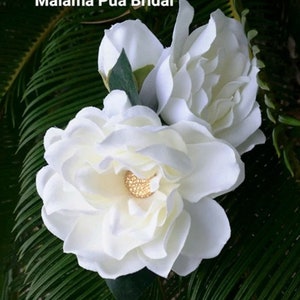 Custom silk Gardenia Wedding headpiece by Malama Pua Bridal.  This hair accessory is a traditional classic Bridal Gardenia hair clip and is created with hand wired crystal center and completed with tropical green leaves.