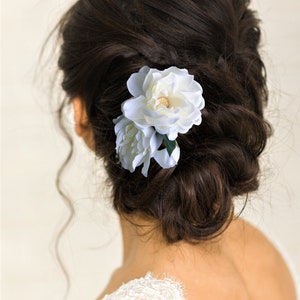 Beautiful bride wearing custom silk Gardenia Wedding headpiece by Malama Pua Bridal.  This hair accessory is a traditional classic Bridal Gardenia hair clip and is created with hand wired crystal center and completed with tropical green leaves.