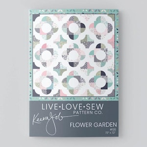 May include: A quilt pattern titled "Flower Garden" by Live Love Sew. The design features a floral pattern in shades of pink, blue, grey, and white. The pattern measures 183 cm x 183 cm. The package has a teal border and a grey bottom section with the designer's name.