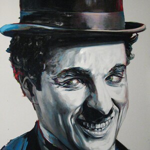 May include: A painted portrait of Charlie Chaplin, the iconic silent film actor. The artwork features Chaplin's smiling face, with a black bowler hat and a dark suit. The painting uses a grayscale palette with touches of color.